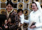 Sr. Damien with a mother and child at the Caritas Center in Fanling.